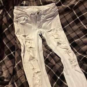 Very Light Blue/White American Eagle Ripped Super Low Rise Jeggings